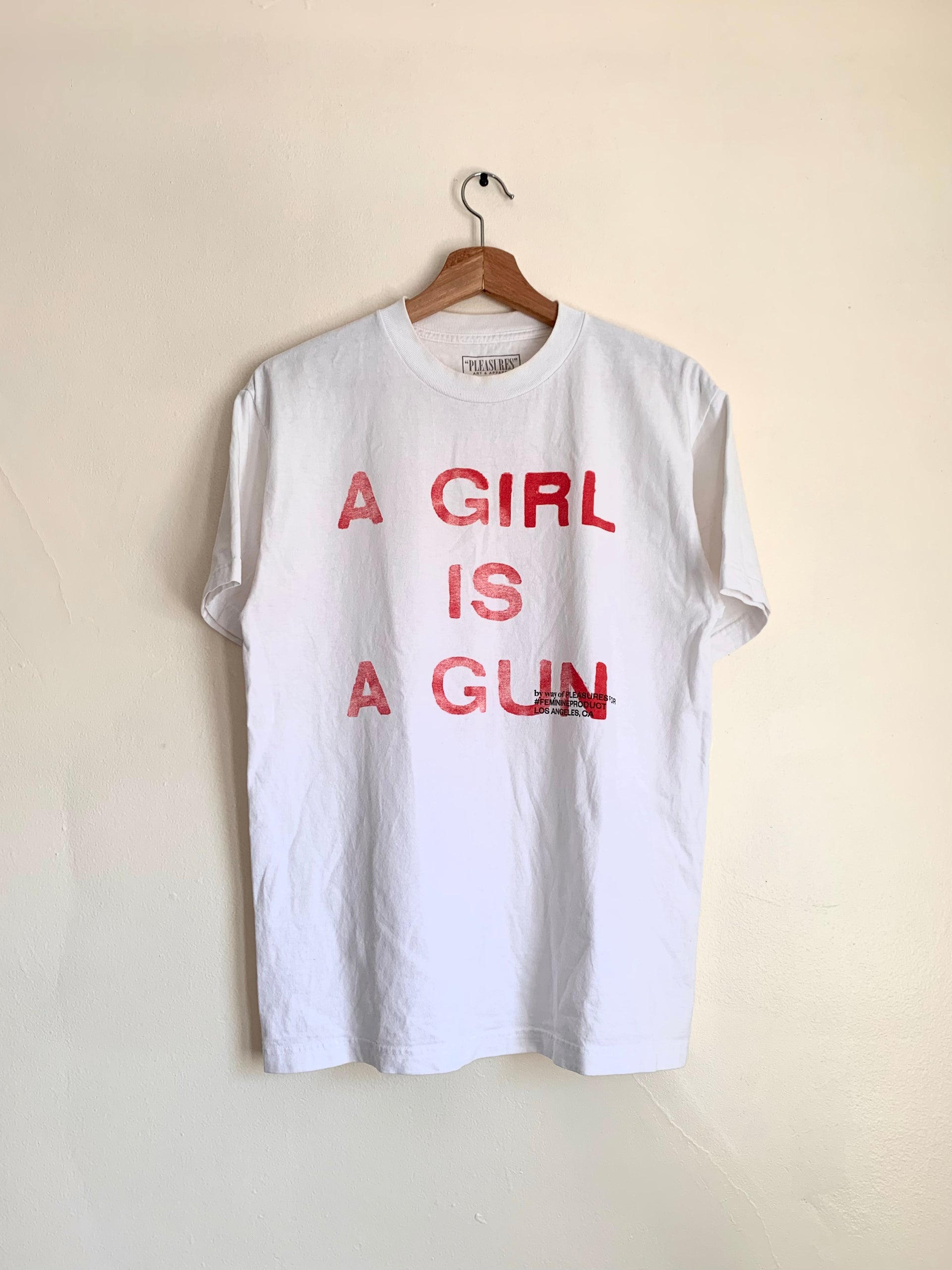 A girl is on sale a gun shirt pleasures